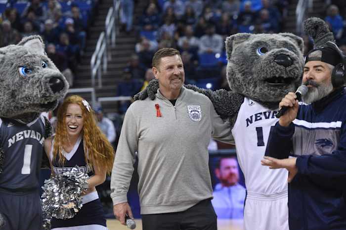 New Nevada head football coach Jeff Choate helps fire up the crowd while taking on UC Davis at Lawlor Events Center in Reno on Dec. 6, 2023.